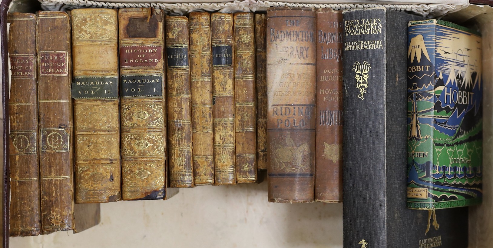 A quantity of leather bound books and a J R R Tolkein volume of The Hobbit with original dust jacket